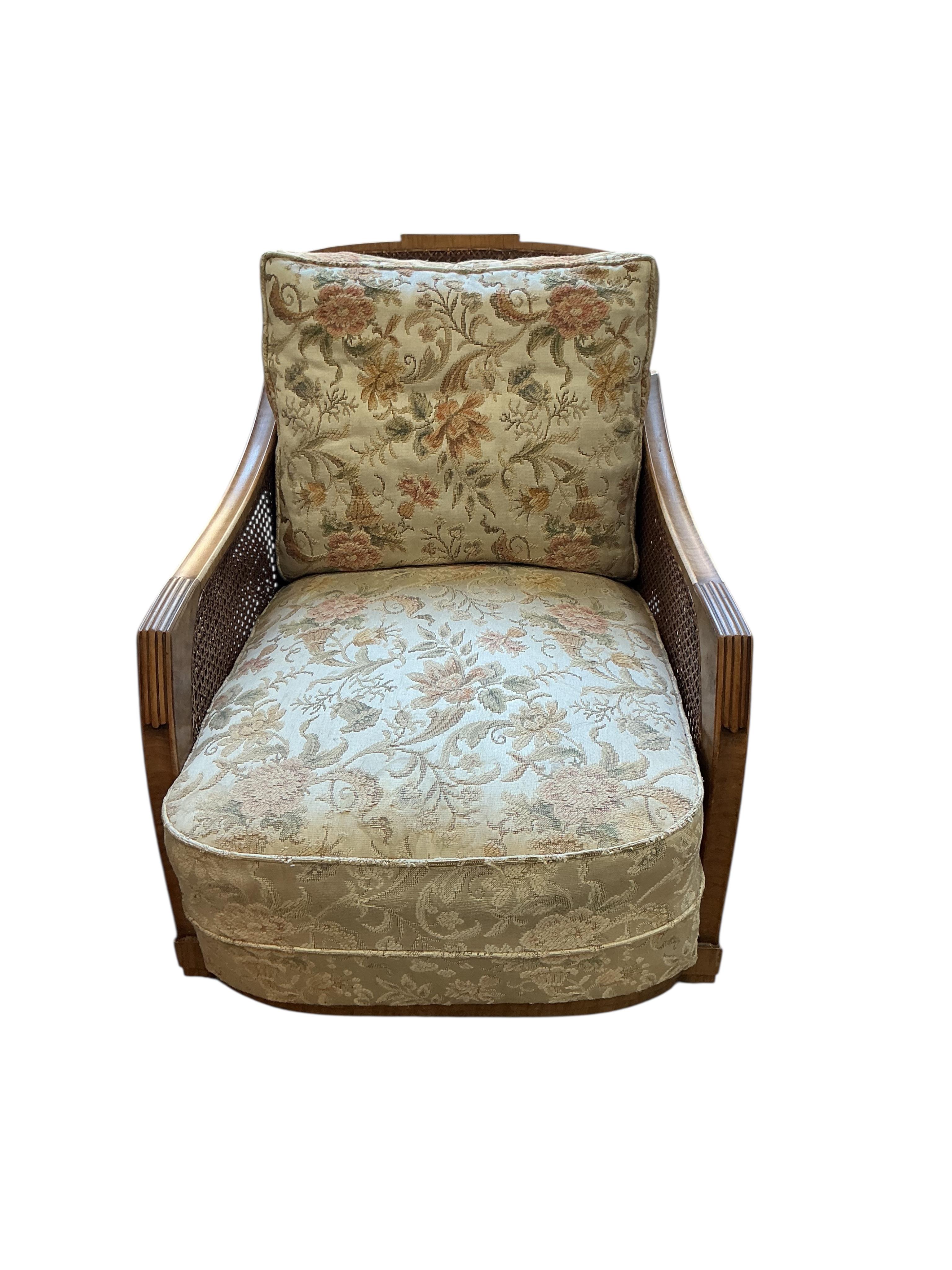A Maple and Co. Art Deco walnut bergere armchair, width 66cm, depth 90cm, height 73cm